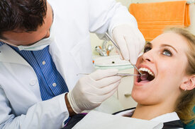 girl getting dental checkup from dentist, family dentistry Fredericksburg, VA